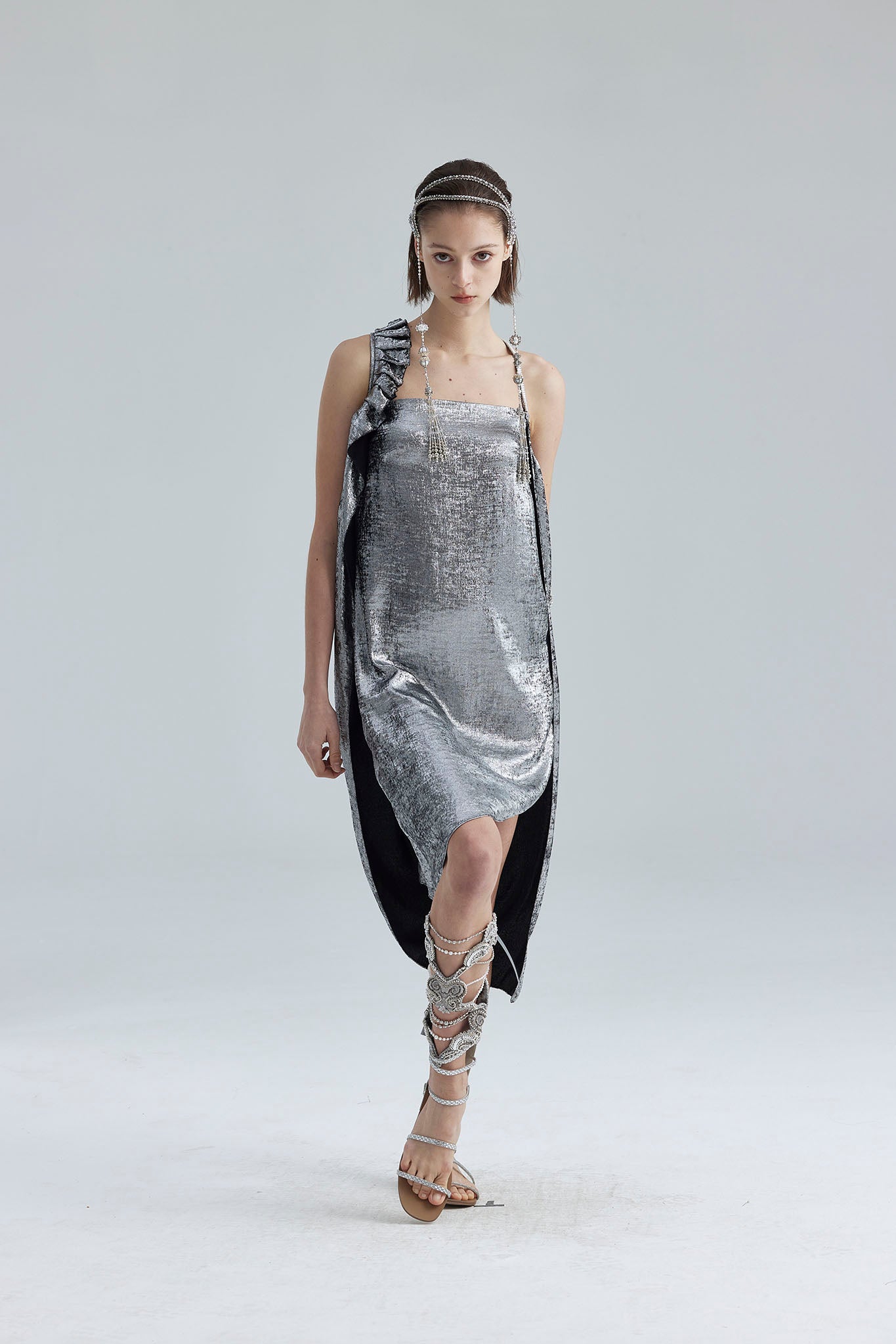 9. The silver asymmetrical structure dress