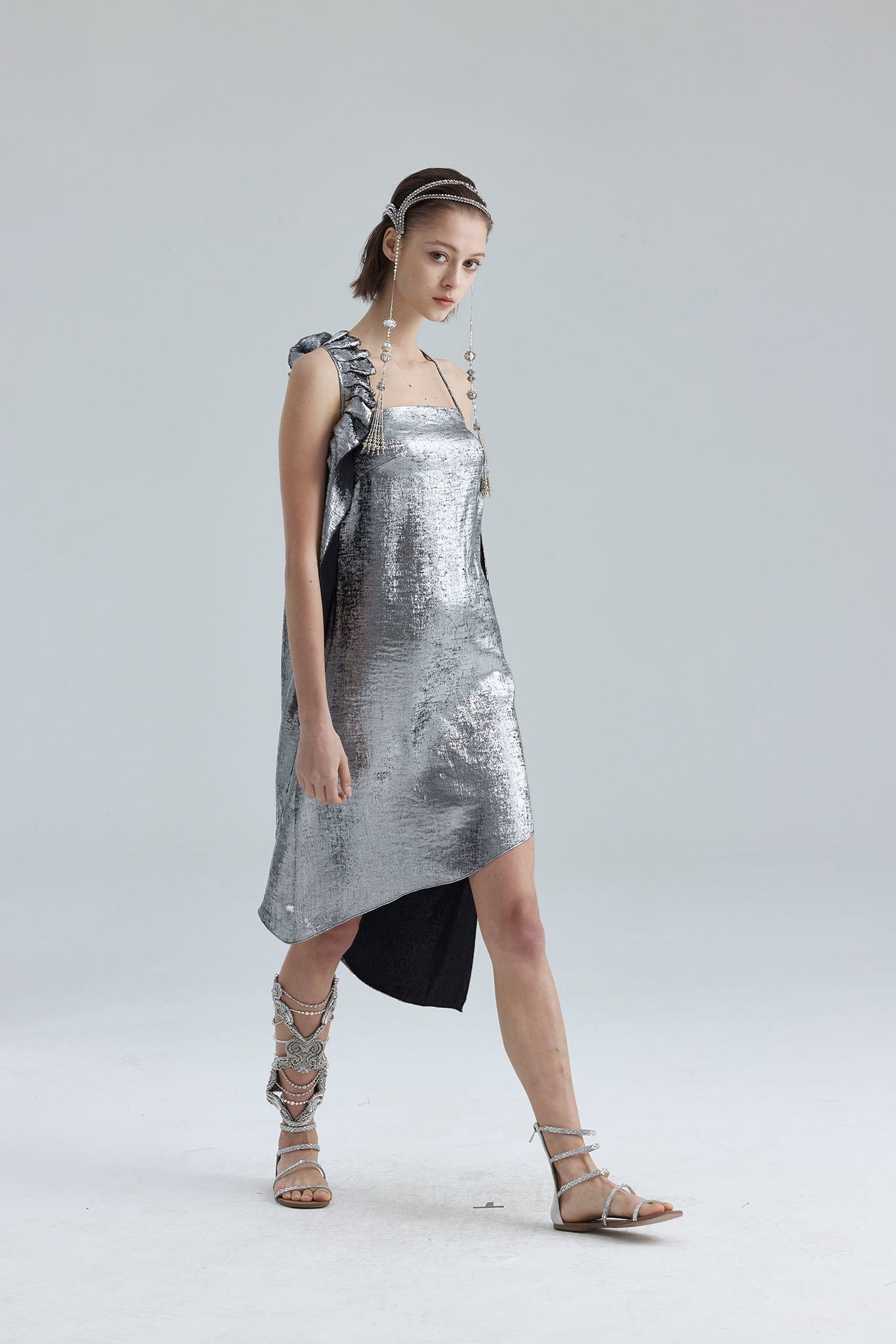 9. The silver asymmetrical structure dress