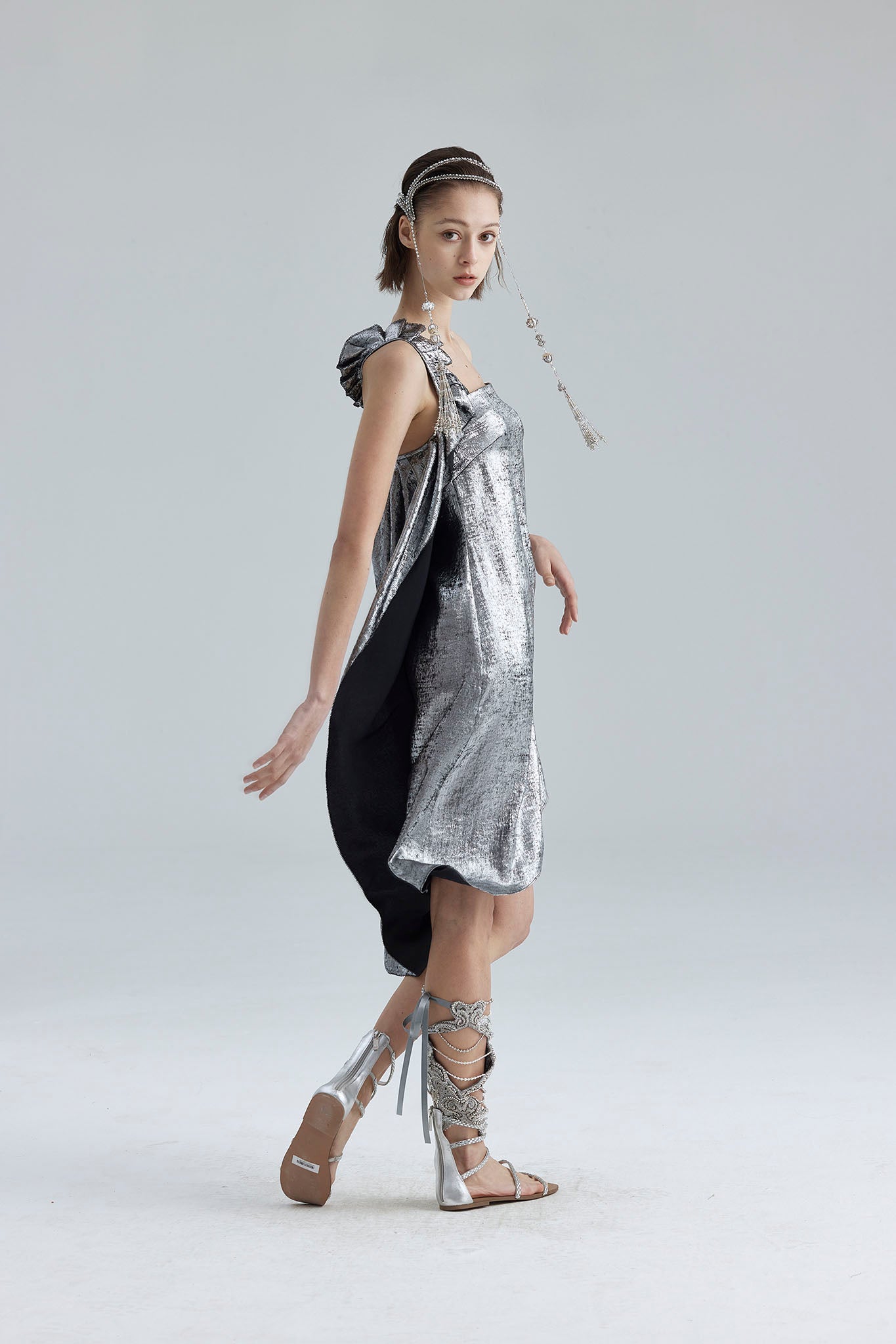 9. The silver asymmetrical structure dress